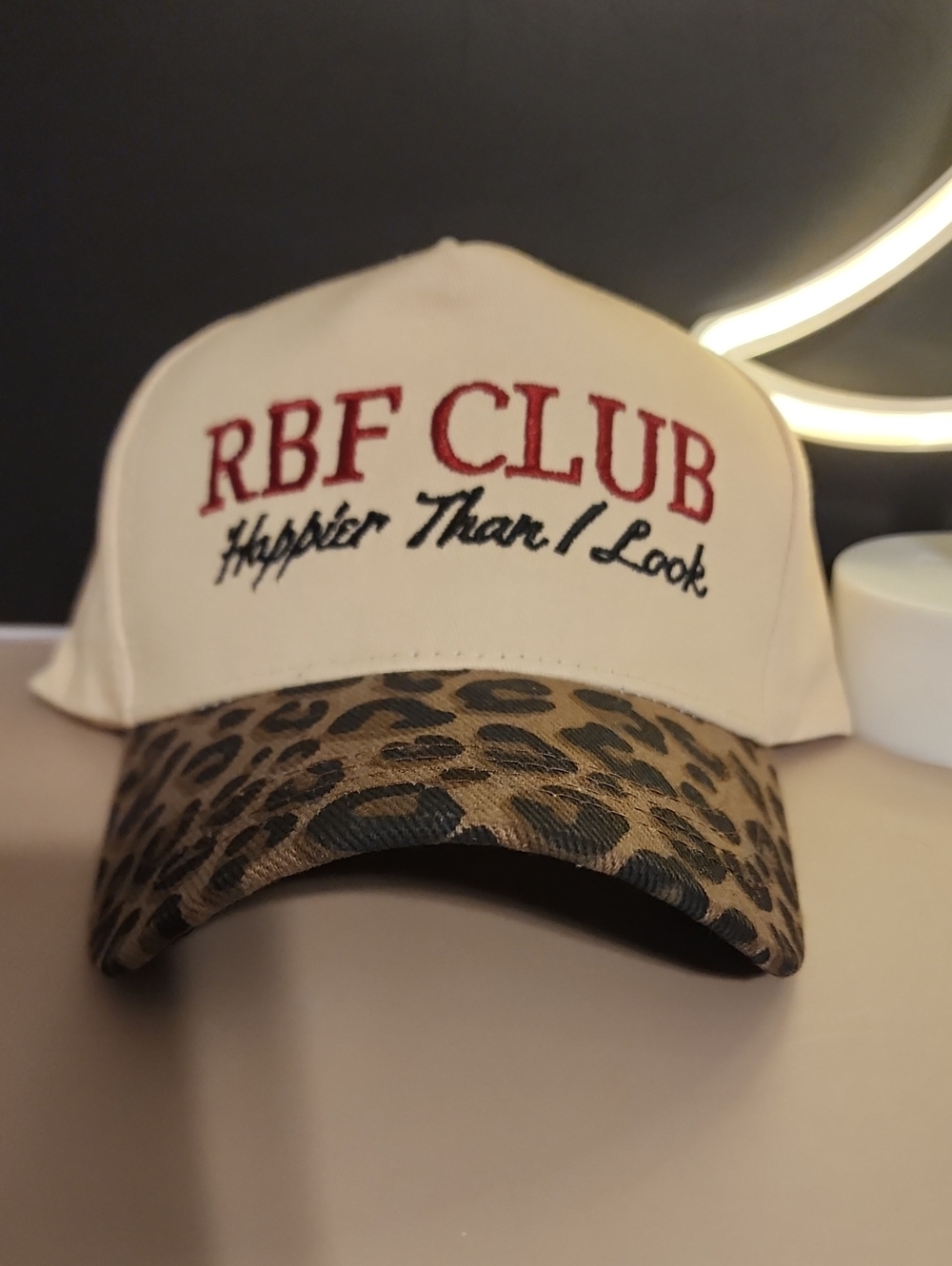 Cream and Leopard Print Baseball Cap with Embroidered Slogan